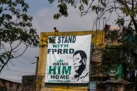 A giant tarpaulin showing support for former President Rodrigo Duterte is displayed on a residential building along Road 10, Tondo, Manila, on Monday. Duterte is currently detained by the International Criminal Court in The Hague, awaiting trial for crimes against humanity.