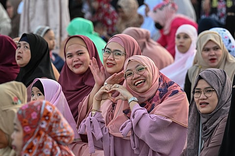 Eid Mubarak! Smiles greet the end of Ramadan, called Eid al-Fitr — one of two major holidays celebrated by Muslims, in which they observe daily fasting from before dawn until sunset. Fasting, one of the five pillars of Islam, is also observed by Catholics during the season of Lent.