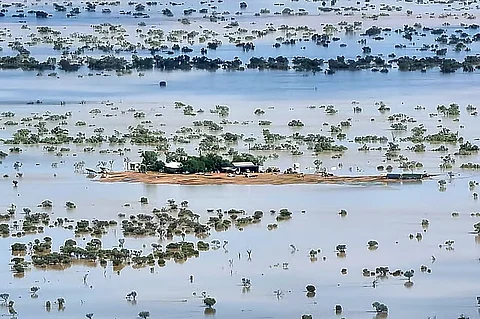 This handout photo taken on March 29, 2025 and released by The Queensland Fire Department shows a homestead under floodwaters near the town of Jundah in south-west Queensland.