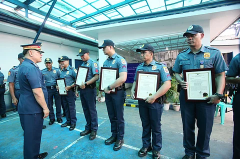 Philippine National Police chief Police General Rommel Marbil congratulates the eighth Antipolo police personnel in their accomplishment during the awarding of medals at the Antipolo Component City Police Station. The recognition is given for their swift arrest of the suspect in a road rage incident that occurred along Marcos Highway in Sitio Calumpang, Barangay San Jose, Antipolo, on Sunday afternoon.