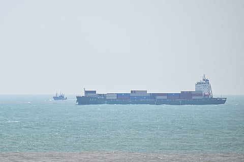 A cargo ship sails past Pingtan island, the closest point between China and Taiwan's main island, in Fujian province on 2 April 2025.