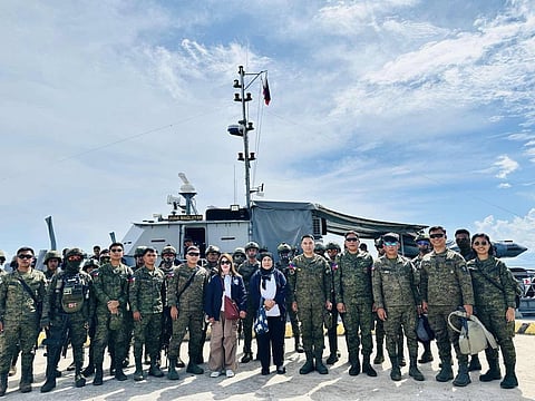 1102nd Brigade Commander Brig. Gen. Delos Santos, along with COMELEC and military officials, during their official visit to Banguingui, Sulu, on 2 April.
