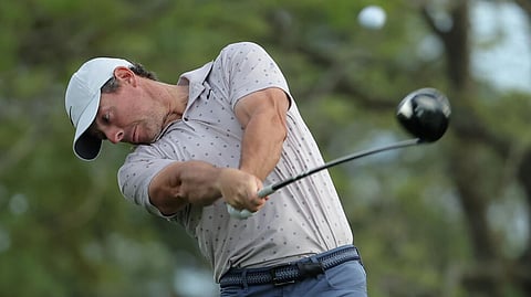 Four-time major winner Rory McIlroy of Northern Ireland smacks a tee shot as he prepares for next week's Masters tournament, where he can complete a career Grand Slam