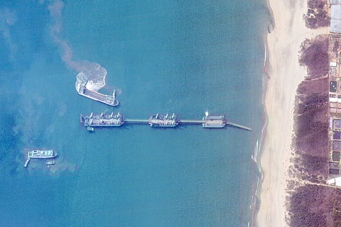 THIS satellite image taken on 25 March and received on 3 April by Planet Labs PBC shows three Chinese barges connected via extendable bridges in waters off Zhanjiang city, in southern China’s Guangdong province. Vast new Chinese barges spotted off the country’s south coast could be used to land heavy equipment and thousands of personnel in a possible invasion of Taiwan, defence experts say. The three barges can connect via extendable ramps to form a relocatable 820-meter-long pier from deep waters to land, according to a memo from the US Naval College.