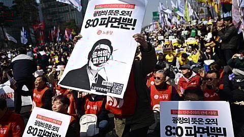 Anti-Yoon protesters react after the Constitutional Court's verdict on the impeachment of South Korea president Yoon Suk Yeol in Seoul
