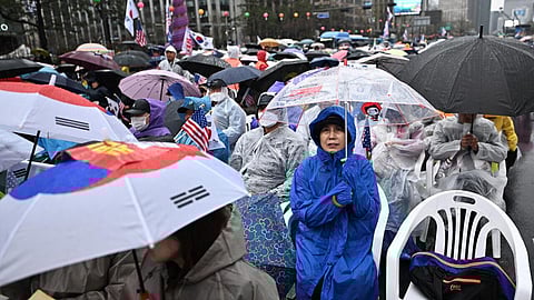Yoon's supporters took to the streets in capital Seoul and braved the rain, chanting slogans against his removal from office.