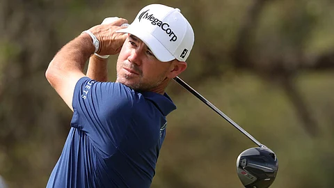 American Brian Harman plays a tee shot on the way to the 36-hole lead at the US PGA Tour Texas Open