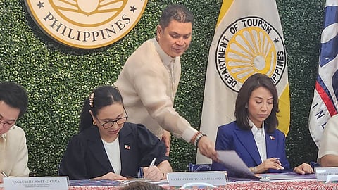 Trade Secretary Cristina Roque (2nd from left) and Tourism Secretary Christina Garcia Frasco, among other officials, sign the Memorandum of Agreement for the convergence of the departments in uplifting tourism-related MSMEs.