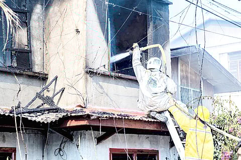 FIREFIGHTERS from the Bureau of Fire Protection, Fariñas Fire and Rescue Volunteers and criminology interns from Northwestern University, Data Center Colleges of the Philippines and Maila Rosario College in Tuguegarao join forces to extinguish a residential blaze that broke out around 7:30 a.m. Monday in Barangay 6, Laoag City.