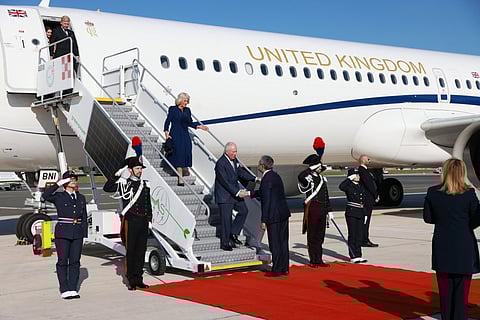 Britain's Queen Camilla and Britain's King Charles III are welcomed by Italy's head of protocol Bruno Antonio Pasquino after landing at Rome's Ciampino airport for a four-day state visit in Italy on 7 April 2025.