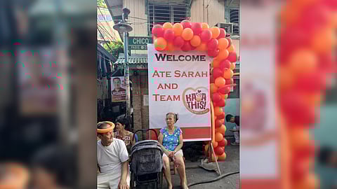 Two senior citizens are patiently waiting for the arrival of Pasig mayoral Sarah Discaya before the start of a caucus meeting in Barangay Sta. Rosa on Monday evening.