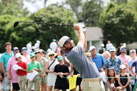 Scottie Scheffler tees off during the practice round of the Drive, Chip and Putt Championship at Augusta National Golf Club in Augusta, Georgia.