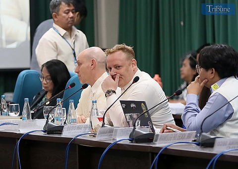 Director of Public Policy for Southeast and South Asia at Meta, Dr. Rafael Frankel, and Meta’s Rob Abrams speak during the joint committee hearing of Public Order and Safety, DICT, and Public Information at the House of Representatives in Quezon City. Outside the venue, protesters tied white ribbons to condemn fake news, red-tagging, and stand in solidarity with EJK victims and others facing political persecution.