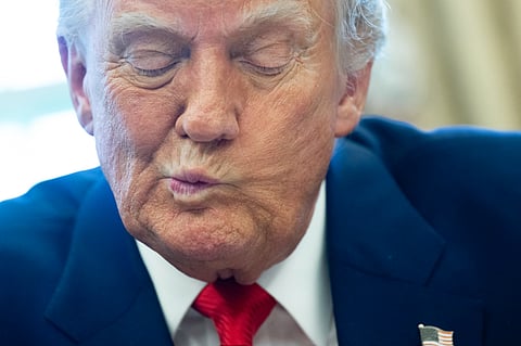 US President Donald Trump speaks after signing an executive order in the Oval Office of the White House on 9 April 2025 in Washington, DC.