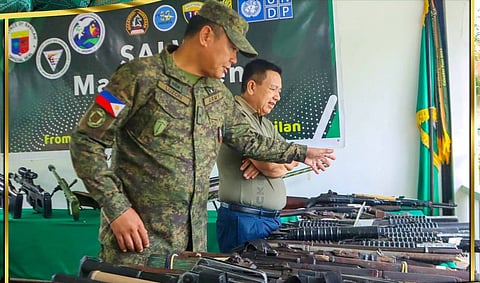 BRIG. Gen. Alvin Luzon (left), commander of the 101st Infantry (Three Red Arrows) Brigade explains to Basilan Governor Jim Hataman-Salliman the different kinds and types of loose war equipment and the damage they may cause to humanity when left uncollected.