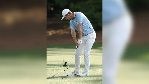 justin Rose of England hits his third shot on the 18th hole during the first round of the 2025 Masters at Augusta National Golf Club on Thursday in Augusta, Georgia.