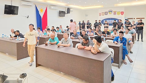 The Chinese nationals who were arrested by operatives from the Bureau of Immigration and other law enforcement agencies for working illegally are waiting for their fate at a site in Quezon province.