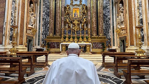 Pope Francis praying
