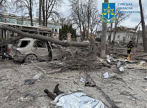This handout photograph taken and released by Ukraine's Sumy Region Prosecutor's Office on 13 April 2025, shows the covered body of a person killed following a missile attack in Sumy, northeastern Ukraine, amid the Russian invasion of Ukraine. A Russian ballistic missile attack on the center of Ukraine's city of Sumy on 13 April 2025, killed at least 21 people and wounded 20 others, Ukraine's state emergency service said.