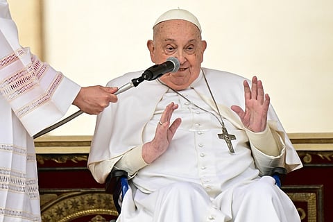 Pope Francis greets the crowd at the end of the mass for Palm Sunday at St. Peter's Square in the Vatican on 13 April 2025.