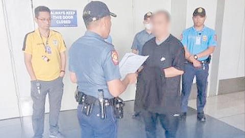 Authorities apprehend a man who was wanted for rape following his arrival at the Ninoy Aquino International Airport Terminal 3 from Abu Dhabi.