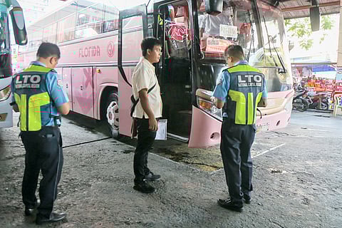 WITH the Holy Week exodus underway, Land Transportation Office personnel inspect a passenger bus in Sampaloc, Manila, on Tuesday — eyes sharp for safety lapses and other violations that compromise travel safety.