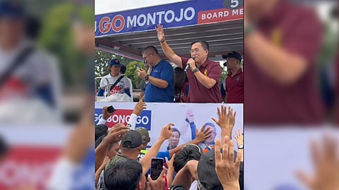 SENATOR Bong Go waves at the crowd during a campaign parade at Banaybanay, Davao Oriental on Tuesday. The senator was joined by Councilor Don Go Montojo and other PDP senatorial candidates.