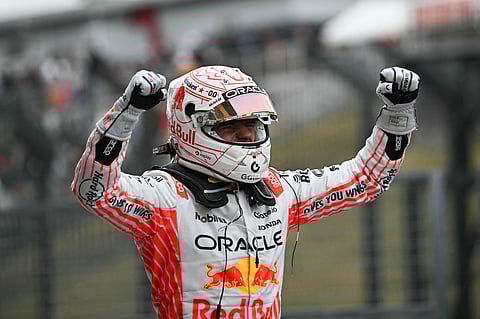 Red Bull Racing's Dutch driver Max Verstappen celebrates winning the Formula One Japanese Grand Prix at the Suzuka circuit in Suzuka, Mie prefecture, Japan on April 6, 2025.