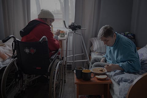 Two elderly women have lunch in their room at a shelter for senior citizens in Kharkiv on March 26, 2025, amid the Russian invasion of Ukraine. The war has disproportionately affected Ukraine's seniors. They are often the last to leave dangerous areas, sometimes because they are physically or financially unable to relocate, often times because they cannot bear to part with their home. People over 60 make up only a quarter of Ukraine's population, but accounted for nearly half of civilian deaths near the front in 2024, according to the United Nations.