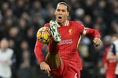 Liverpool's Dutch defender #04 Virgil van Dijk controls the ball during the English Premier League football match between Tottenham Hotspur and Liverpool at the Tottenham Hotspur Stadium in London, on 22 December 2024.