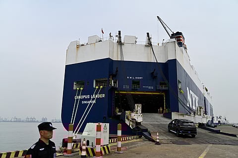 A vehicle by Chinese EV manufacturer BYD is loaded on a ship of the NYK line in the Port of Guangzhou, China's southern Guangdong province, on 22 February 2025.