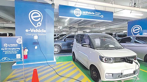 AN electric vehicle charges at SM North EDSA’s Electric Vehicle Charging Station — one of 123 across 69 SM Supermalls nationwide.