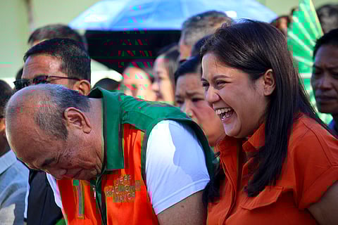 Castillejos Mayor Jeff Khonghun and Senatorial candidate Camille Villar share a light moment during the flag raising ceremony held at the Municipal Hall in Castillejos.