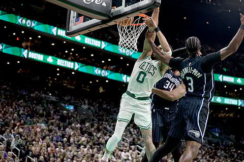 Jayson Tatum of the Boston Celtics gets hammered by Kentavious Caldwell-Pope of the Orlando Magic during Game 1 of their NBA Eastern Conference playoff series.