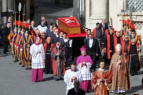 In this solemn image released by Vatican Media on Wednesday, pallbearers carry the coffin of the late Pope Francis in a quiet, reverent procession from the chapel of Santa Marta to St. Peter’s Basilica — marking the final journey of a beloved pontiff whose legacy echoes through the heart of the Church.