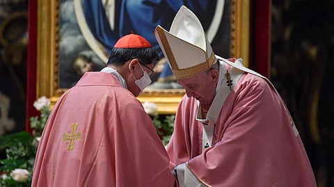 Pope Francis (R) thanks Philippine Cardinal Luis Antonio Tagle after he addressed a message during a mass to mark 500 years of Christianity in the Philippines, on 14 March 2021 at St. Peter's Basilica in The Vatican.
