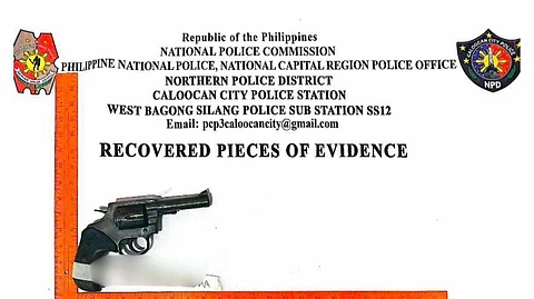 A seized caliber .38 revolver is displayed with measurement guides by the Caloocan City Police, marked as recovered evidence in a firearm threat incident in Barangay 176-A.
