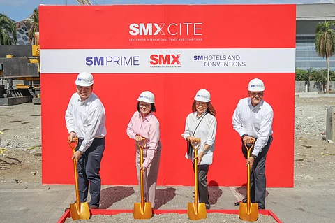 L-R: Mr. Hans “Chico” Sy, Jr. – President, SM Engineering Design and Development Corp.; Ms. Peggy Angeles – Executive Vice President, SM Hotels and Conventions Corp.; Ms. Elizabeth T. Sy – President, SM Hotels and Conventions Corp.; and Mr. Walid Wafik – Senior Vice President for Operations, SM Hotels and Conventions Corp., during the groundbreaking ceremony of SMXCITE, held onsite earlier this month. With golden shovels in hand, this ceremonial event marks the beginning of a new chapter for SMX Convention Center.