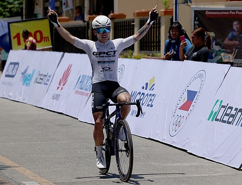 DAEYOUNG Joo celebrates as he crosses the finish line by his lonesome in Stage 1 of the Tour of Luzon on Thursday in Paoay, Ilocos Norte.