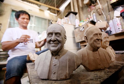 Clay artist Rolando Magboo works on a commissioned sculpture of Pope Francis at his studio in Riverside, Marikina City. Known for his realistic clay and fiberglass works, Magboo has spent over 30 years crafting everything from portrait busts to life-sized figures.