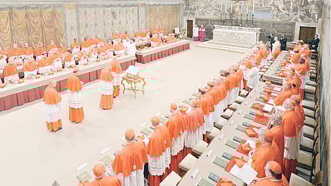 Cardinals line up in the Sistine Chapel to take an oath of secrecy before the start of the conclave to elect a new pope at the Vatican on 12 March 2013.