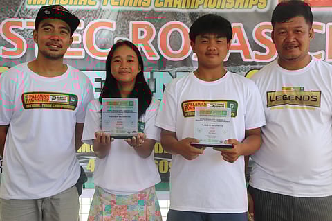 Double champion Kathryn Bugna (second from left) and Bjorn Castigador (second from right) display their trophies alongside Villareal Tennis Club officials Mark Gonzales (left) and Cromwell Teves after completing impressive twin-title runs in the Vistec Roxas National Tennis Championships.