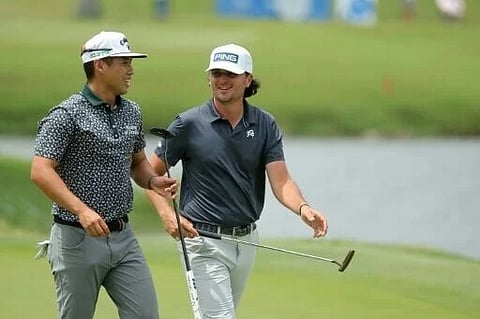 Americans Isaiah Salinda, left, and Kevin Velo, right, combined to fire a four-ball record 14-under 58 and seize the first-round lead at the PGA Tour's Zurich Classic pairs event