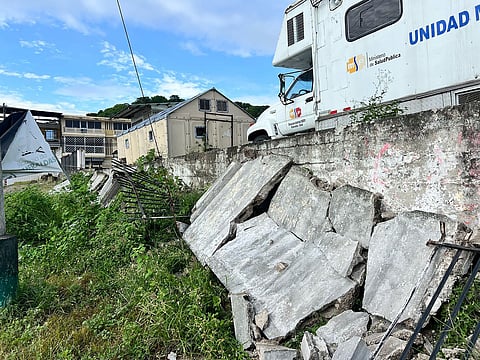Collapsed concrete wall and damaged fence outside a health unit in Esmeraldas, Ecuador, following a 6.3-magnitude earthquake on 25 April 2025.