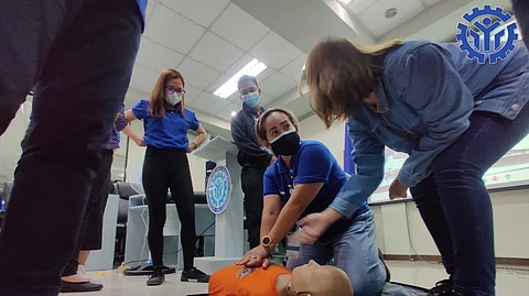 A member of the Technical Education and Skills Development discuss the proper resuscitation process to a trainee as part of the local government of Manila’s skills training program.