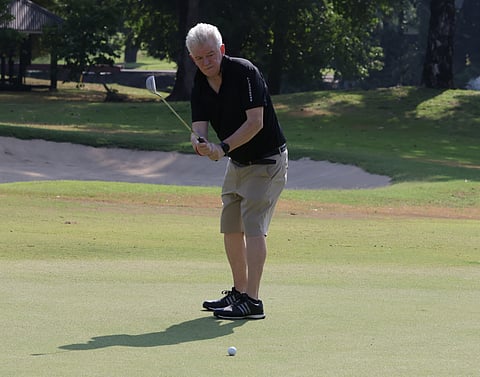 British Chamber of Commerce Philippines executive chairman Chris Nelson watches his putt on the first green during The Great British Golf Tournament at the West course of the Wack Wack Golf and Country Club in Mandaluyong on Thursday.