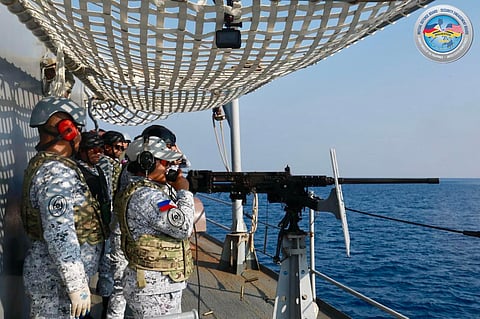 Locked and loaded Philippine Navy personnel operate a .50 caliber gun aboard the BRP Ramon Alcaraz during a surface target shooting exercise. The drill is part of the Gunnery Exercise within the Multilateral Maritime Event of Balikatan 2025.