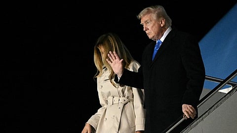 US President Donald Trump and First Lady Melania Trump step off Air Force One upon arrival at Leonardo da Vinci International Airport in Rome on 25 April 2025. Trump is in Rome to attend the funeral for Pope Francis.