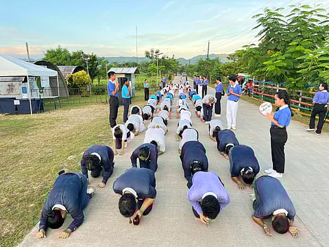 Tzu Chi Ormoc officials and volunteers perform the three steps-one bow ritual at the Tzu Chi Great Love Village in Ormoc, Leyte last 21 April 2025.
