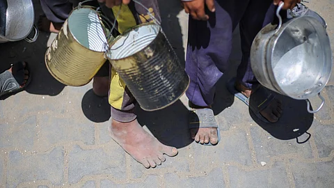 Thousands of Gazan children queue every day at community kitchens in the hope of securing food for their families